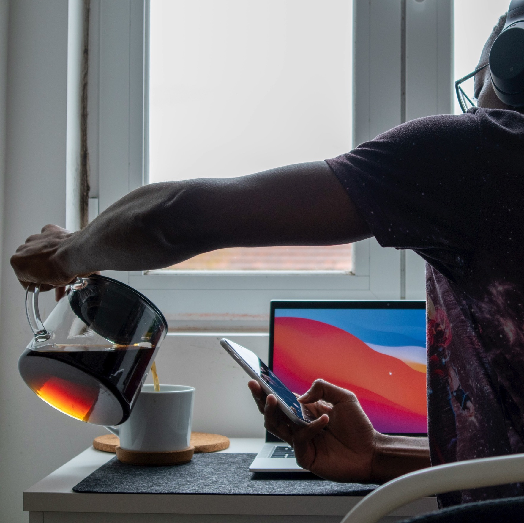 A quiet workspace with a laptop and coffee, from the portfolio deck